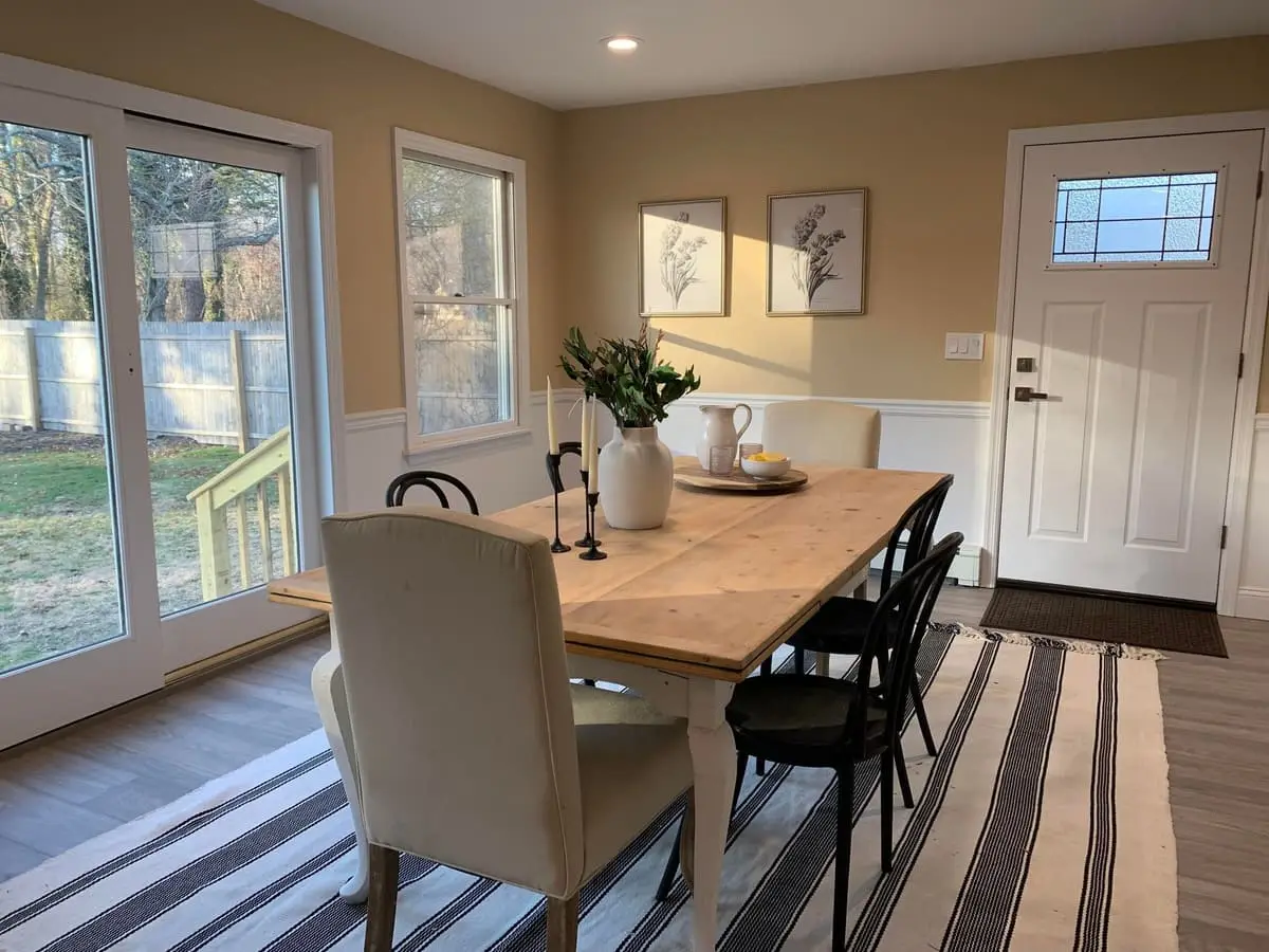 Selling a house near the LIRR in Islip: renovated dining area with sliding doors to the backyard